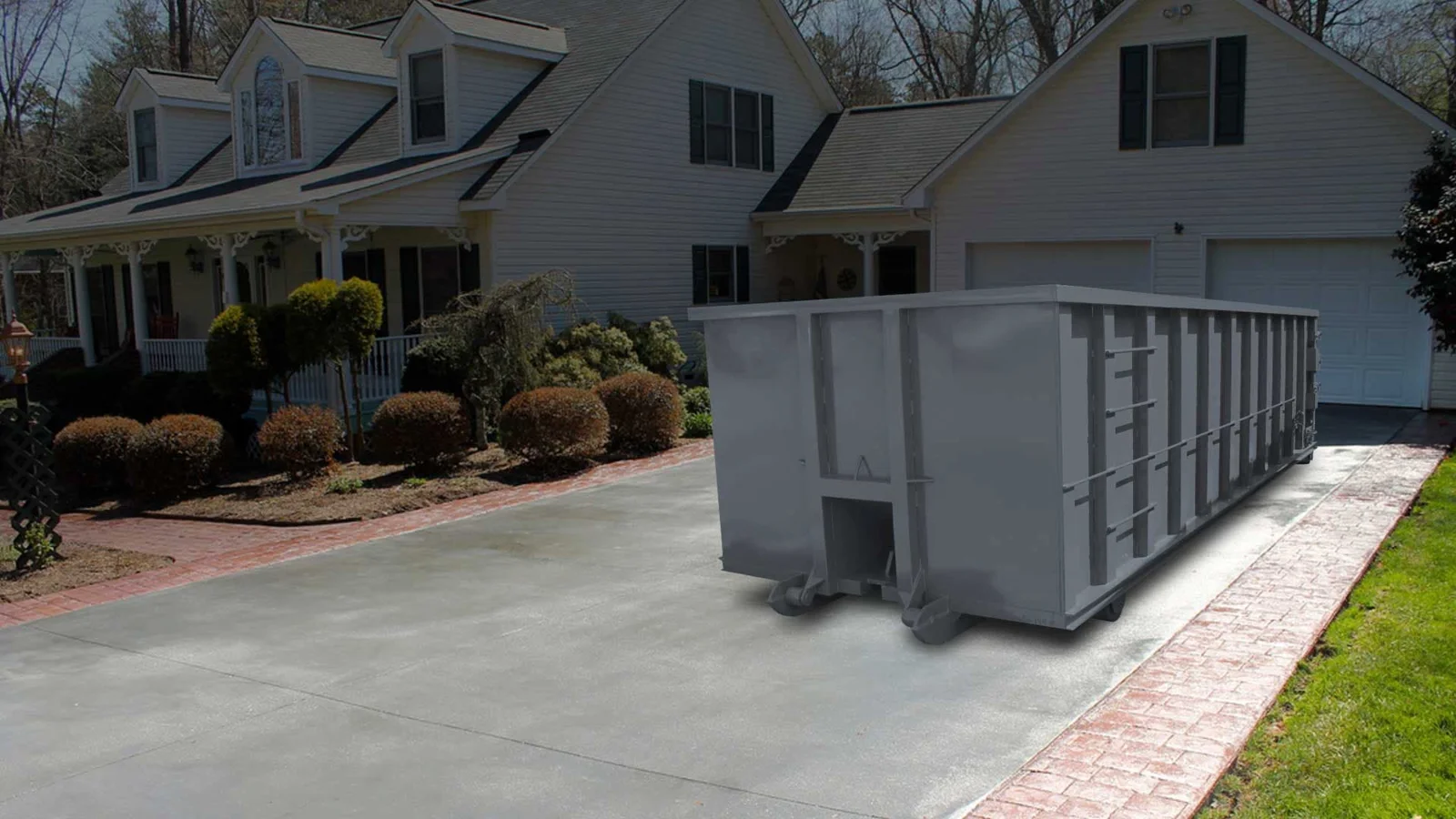 Roll off dumpster placed in a home driveway